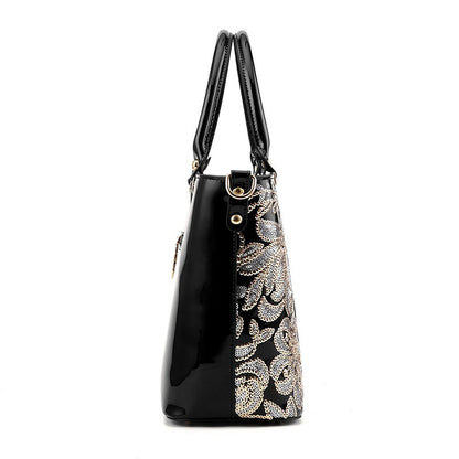 Embroidered bright leather shoulder bag